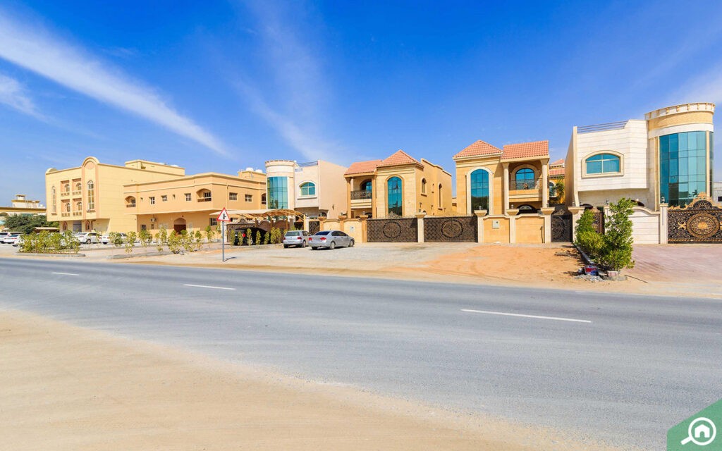 How has the development of infrastructure projects influenced property values in Ajman?​
